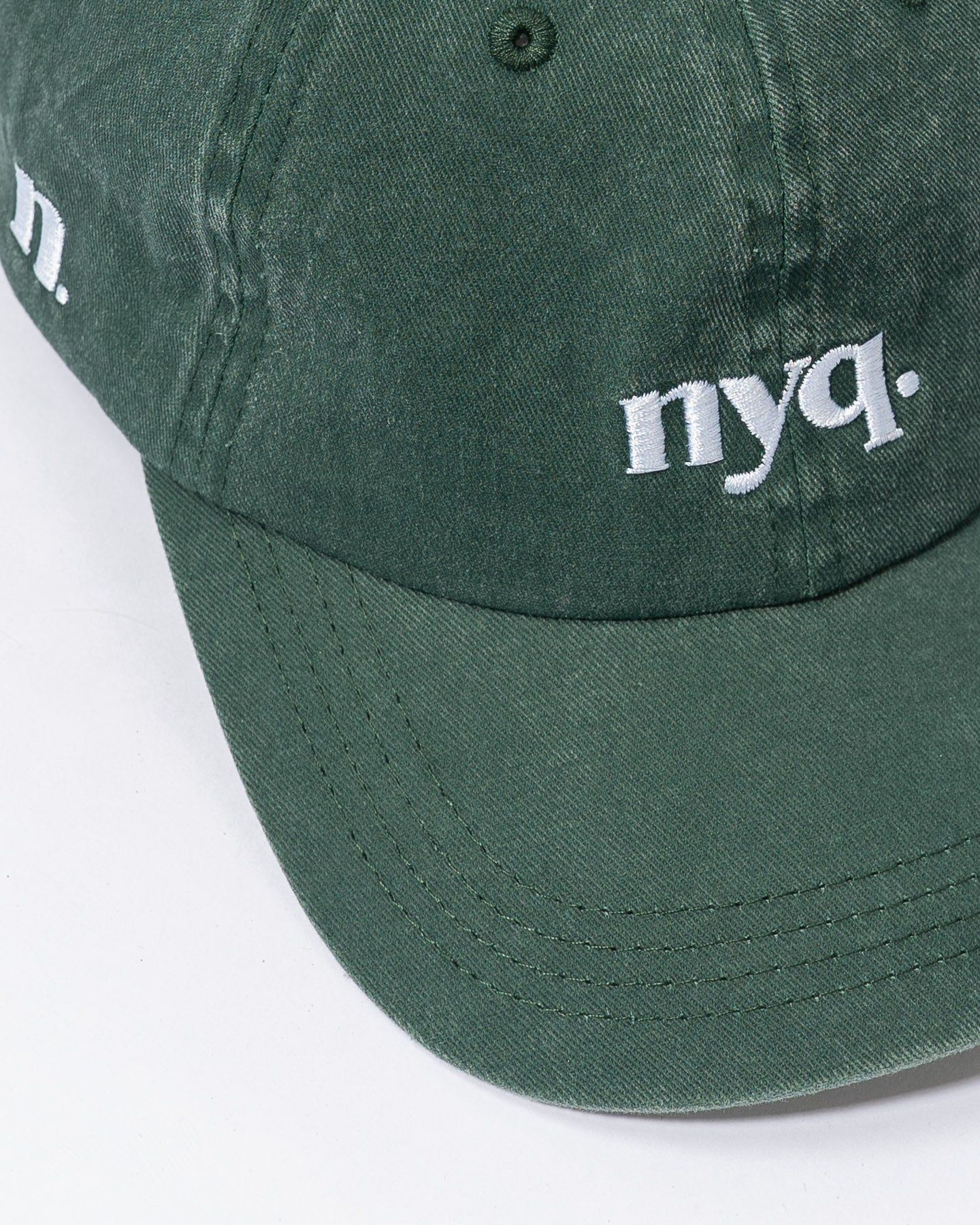 forest green cap.