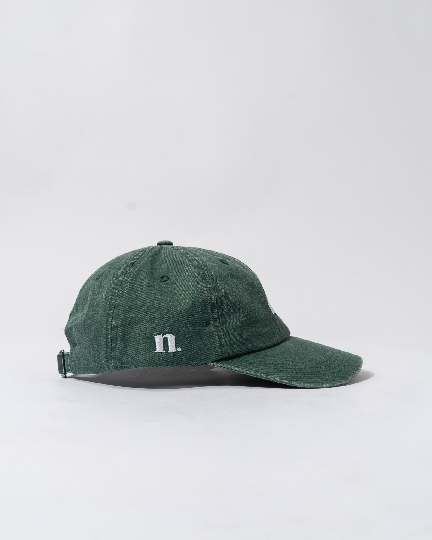 forest green cap.