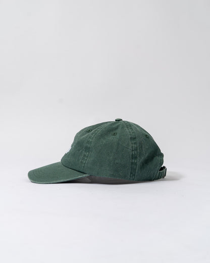 forest green cap.