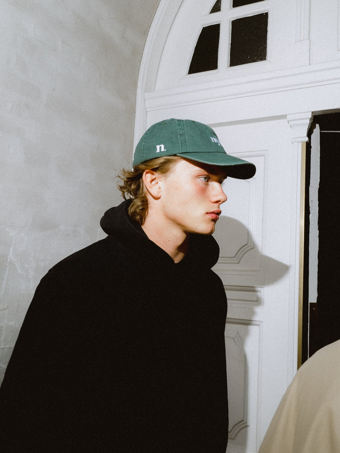 forest green cap.