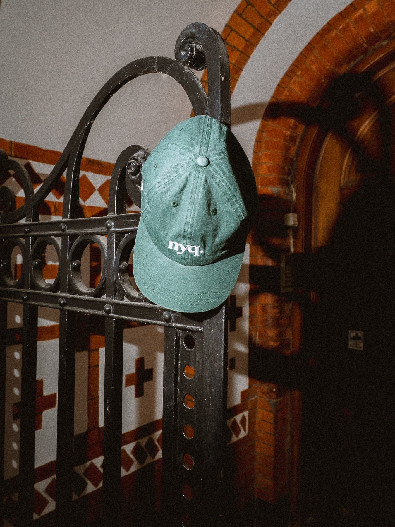 forest green cap.