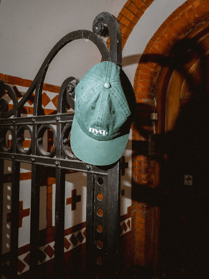 forest green cap.